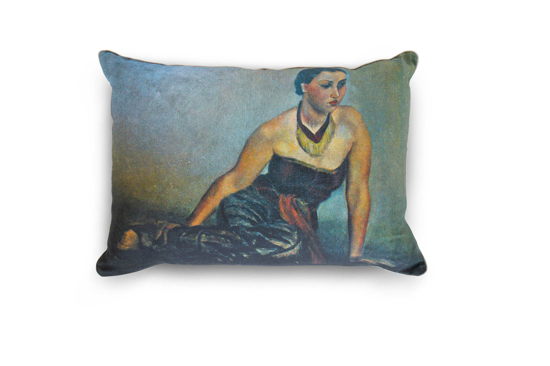 A linen pillow with a painted artwork printed on it, depicting a woman lounging on the floor in an evening gown and statement necklace. The pillow is pictured against a white background.. The 100% Natural European Linen Pillow Includes 10/90 Down / Feather Blend Insert. Sophisticated and refined. Modern yet classic. A true friend for years to come. Dimensions: 17"x24"