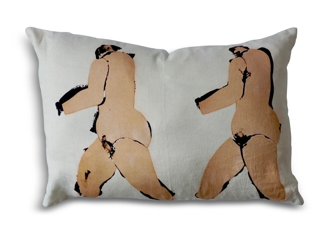A linen pillow with a painted artwork printed on it, depicting two abstract human figures against an off white background, is pictured against a pure white background.. The 100% Natural European Linen Pillow Includes 10/90 Down / Feather Blend Insert. Sophisticated and refined. Modern yet classic. A true friend for years to come. Dimensions: 17"x24"