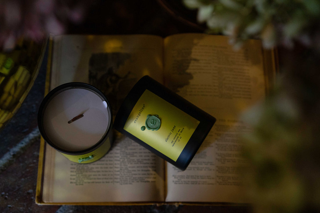 Soy coconut wax scented candle with cedar wood wick. Hand-poured in Portland Maine. Black matte glass jar, chartreuse label, mint green wax seal.